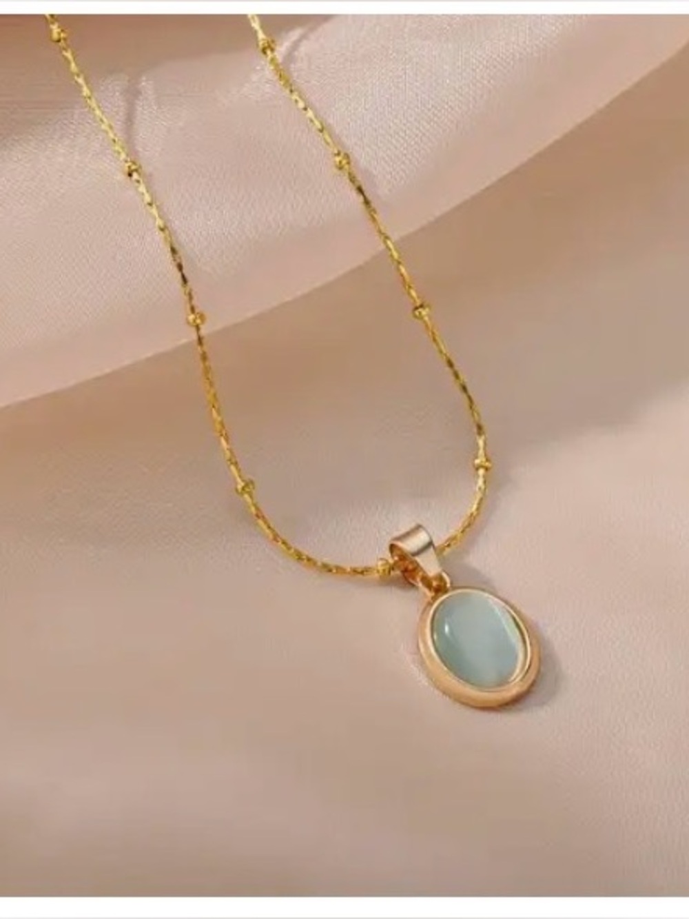 Gold Necklace with Light Blue Oval Pendant